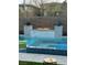 Stunning pool and spa with a fire feature for ambiance and relaxation at 12451 Island Bells Ave, Las Vegas, NV 89138