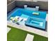 Inviting pool area features a spa, lounge chairs, and a built-in fire pit for relaxation and entertainment at 12451 Island Bells Ave, Las Vegas, NV 89138