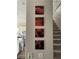 Inviting stairway features modern artwork and leads to the upper level of the home at 12451 Island Bells Ave, Las Vegas, NV 89138