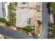 Overhead shot of a modern home with a private pool, landscaped yard, and neighborhood at 18 Sugarberry Ln, Las Vegas, NV 89135