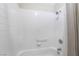 Bright bathroom features a shower over tub and white tiling surround at 1804 Michael Ct, Henderson, NV 89014