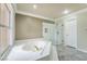 Relaxing bathroom with a tiled tub, marble shower with glass doors, and recessed lighting at 1804 Michael Ct, Henderson, NV 89014