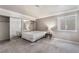Simple bedroom with mirrored closet doors and a bright window at 1804 Michael Ct, Henderson, NV 89014