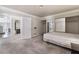 Spacious bedroom features carpet flooring, modern closet, and an open door to connecting rooms at 1804 Michael Ct, Henderson, NV 89014