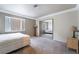 This bedroom features a window, carpet flooring, and neutral colors, making a cozy and inviting space at 1804 Michael Ct, Henderson, NV 89014