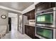 Kitchen featuring stainless steel appliances, double oven, and wood cabinetry at 1804 Michael Ct, Henderson, NV 89014