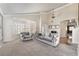 Bright living room with neutral walls, vaulted ceiling, and large bay window with plush seating arrangement at 1804 Michael Ct, Henderson, NV 89014
