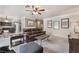 Open-concept living room featuring plush seating and neutral color palette at 1804 Michael Ct, Henderson, NV 89014
