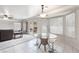 Bright and airy living room with tile floors, large windows, and access to the backyard at 1804 Michael Ct, Henderson, NV 89014