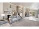 Spacious open-plan living area features high ceilings, neutral tones, and views to the backyard at 1804 Michael Ct, Henderson, NV 89014