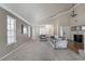 Bright living room features large windows, vaulted ceiling and neutral walls with hardwood flooring at the entry at 1804 Michael Ct, Henderson, NV 89014