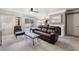 Cozy living room featuring plush sofa, fireplace, and sliding glass doors to the patio at 1804 Michael Ct, Henderson, NV 89014