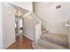 The foyer features hardwood floors, a neutral palette, and a carpeted staircase leading to the upper level at 1804 Michael Ct, Henderson, NV 89014