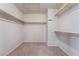 Spacious walk-in closet features built-in shelving and ample storage space for an organized wardrobe at 1804 Michael Ct, Henderson, NV 89014