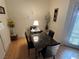 Dining space shows table with seating, bright light, and modern wood-look floors at 1830 N Pecos Rd # 230, Las Vegas, NV 89115