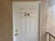 A clean, white front door with the unit number '230' displayed prominently at 1830 N Pecos Rd # 230, Las Vegas, NV 89115