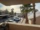 View from patio showing parking area and community landscaping with palm trees at 1830 N Pecos Rd # 230, Las Vegas, NV 89115