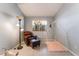 Bright bedroom with a comfortable chair, floor lamp and window view at 1835 Swallow Hill Ave, Henderson, NV 89012