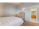 Comfortable bedroom with queen bed, side tables and dresser at 1835 Swallow Hill Ave, Henderson, NV 89012