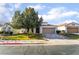 Attractive single-story home with mature tree providing shade to the home's facade at 1835 Swallow Hill Ave, Henderson, NV 89012