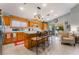 Spacious kitchen boasts an island with bar stools and adjacent to a cozy seating area by sliding doors at 1835 Swallow Hill Ave, Henderson, NV 89012