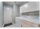 Efficient laundry room features a washer, dryer, and ample cabinet space for storage at 1835 Swallow Hill Ave, Henderson, NV 89012