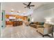 Open-concept living space featuring kitchen, living room, and dining area at 1835 Swallow Hill Ave, Henderson, NV 89012