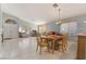 Open-concept living and dining area featuring tile flooring and natural lighting at 1835 Swallow Hill Ave, Henderson, NV 89012