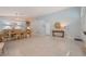 Spacious living and dining area with tile floors, neutral paint, and stylish decor at 1835 Swallow Hill Ave, Henderson, NV 89012