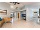 Open-concept living room featuring neutral paint, tile floors, and a view of the front entry at 1835 Swallow Hill Ave, Henderson, NV 89012