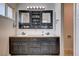 Bathroom vanity with double sinks and decorative mirrored cabinet offering ample storage at 216 Candlelight St, Las Vegas, NV 89145