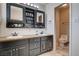 Bathroom featuring a double sink vanity, and a toilet at 216 Candlelight St, Las Vegas, NV 89145
