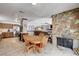 View of the dining area, fireplace, and kitchen in an open concept layout, perfect for entertaining at 216 Candlelight St, Las Vegas, NV 89145