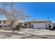 Attractive single-story home with a large driveway and an attached two-car garage at 216 Candlelight St, Las Vegas, NV 89145