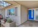 A welcoming entrance with a bright blue front door and decorative metal railing at 216 Candlelight St, Las Vegas, NV 89145