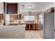 Well-lit kitchen with modern appliances and unique wood-patterned cabinetry at 216 Candlelight St, Las Vegas, NV 89145