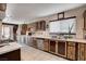 Well-lit kitchen featuring unique cabinetry, countertops, and modern appliances with outdoor view at 216 Candlelight St, Las Vegas, NV 89145