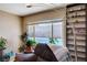 Comfortable living room with a view of the backyard pool and a stylish bookshelf at 216 Candlelight St, Las Vegas, NV 89145