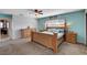 Bright main bedroom with ensuite access, natural light, ceiling fan, and neutral colored walls at 216 Candlelight St, Las Vegas, NV 89145