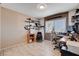 Home office featuring modern shelving, a large window, and tile flooring at 216 Candlelight St, Las Vegas, NV 89145