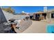 Outdoor patio area showing dining set, lounge, and access to the pool at 216 Candlelight St, Las Vegas, NV 89145