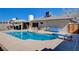 Backyard with a pool, diving board and patio area perfect for entertaining at 216 Candlelight St, Las Vegas, NV 89145