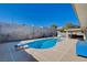 Backyard pool with diving board and covered patio area, great for summer relaxation at 216 Candlelight St, Las Vegas, NV 89145