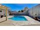 Sparkling blue pool with diving board in a private backyard setting at 216 Candlelight St, Las Vegas, NV 89145