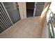 Outdoor balcony featuring tile flooring and sliding glass door access to the interior space at 220 E Flamingo Rd # 116, Las Vegas, NV 89169