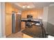 Well-equipped kitchen features stainless steel appliances, granite countertops, and wood cabinets at 220 E Flamingo Rd # 116, Las Vegas, NV 89169