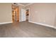 Bright living room featuring laminate flooring and an open floor plan with access to the kitchen at 220 E Flamingo Rd # 116, Las Vegas, NV 89169