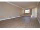 Spacious living room featuring wood-look floors, neutral walls, and natural light at 220 E Flamingo Rd # 116, Las Vegas, NV 89169