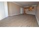 Bright living room boasts wood-look floors, neutral walls, and access to the kitchen at 220 E Flamingo Rd # 116, Las Vegas, NV 89169