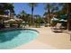 Inviting spa with steps to enter and an attached seating area under the warm sunshine at 220 E Flamingo Rd # 116, Las Vegas, NV 89169